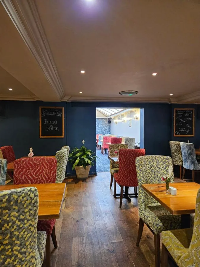 Restaurant with tables and chairs at The Queens Hotel in York